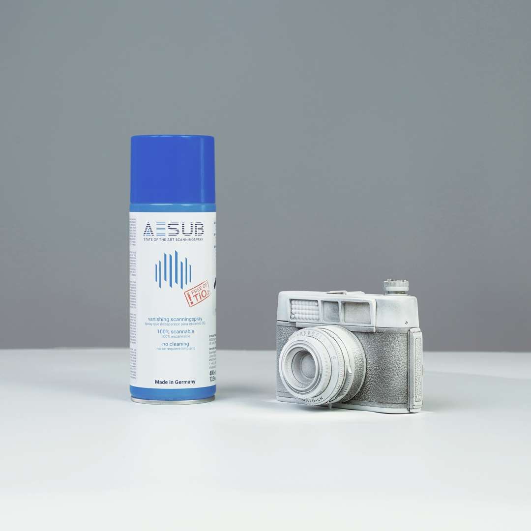 Vintage camera fully coated with AESUB Blue uniform matte-white layer — ready for optical 3D scanning with consistent diffuse reflectance