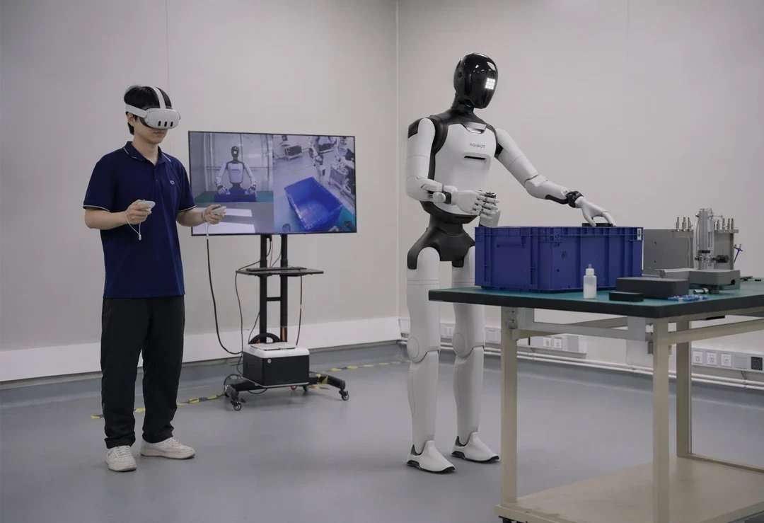 An operator uses a virtual reality headset to control the robot