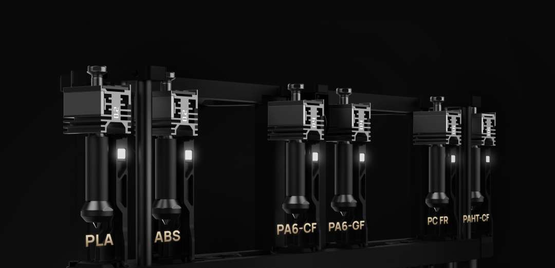 Seis módulos extrusores de Bambu Lab H2C marcados con PLA, ABS, PA6-CF, PA6-GF, PC FR y PAHT-CF