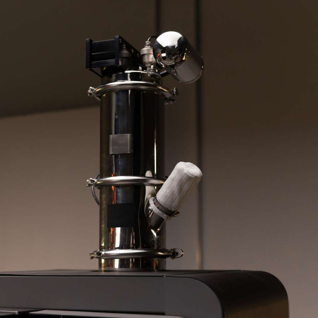 Fuse Sift cyclone separator module with reflective metal housing, sensor mounts and an insulated tube above the printer