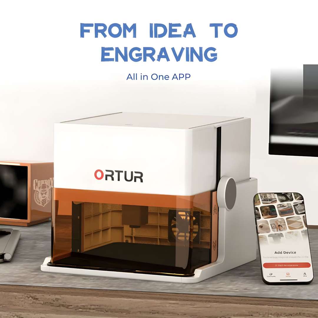 Ortur R1 5W white laser engraver on a desk next to a smartphone showing the Ortur mobile app interface with device pairing and design library controls