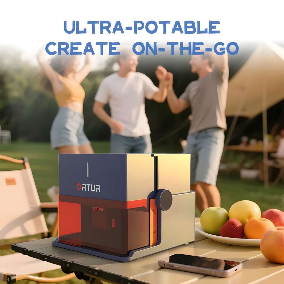 Ortur R1 portable laser engraver operating outdoors on a folding camp table at a sunny social gathering, demonstrating genuine on-the-go personalisation capability