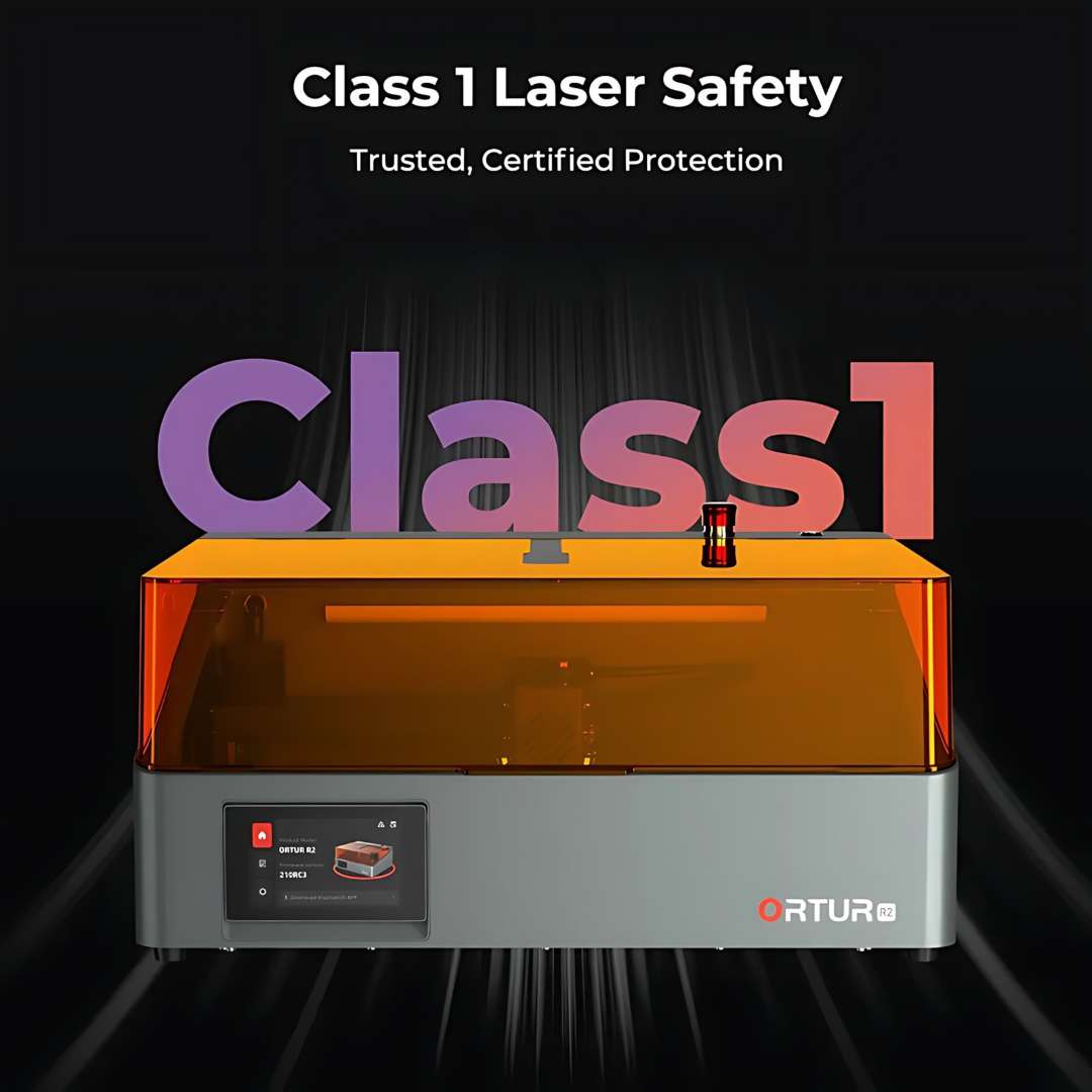 Class 1 laser engraver with orange polycarbonate enclosure, touchscreen control panel, and certified safety containment