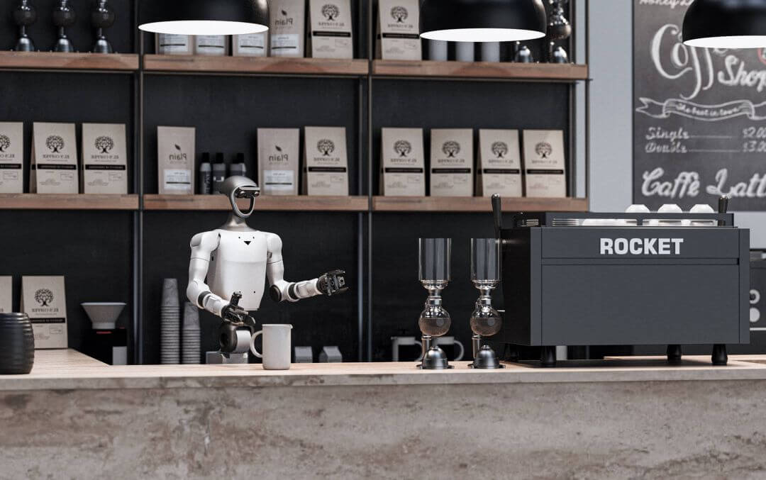 Robot humanoide Unitree G1-D Flagship trabajando de forma autónoma como barista en una cafetería, detrás de una barra junto a una máquina de espresso Rocket profesional
