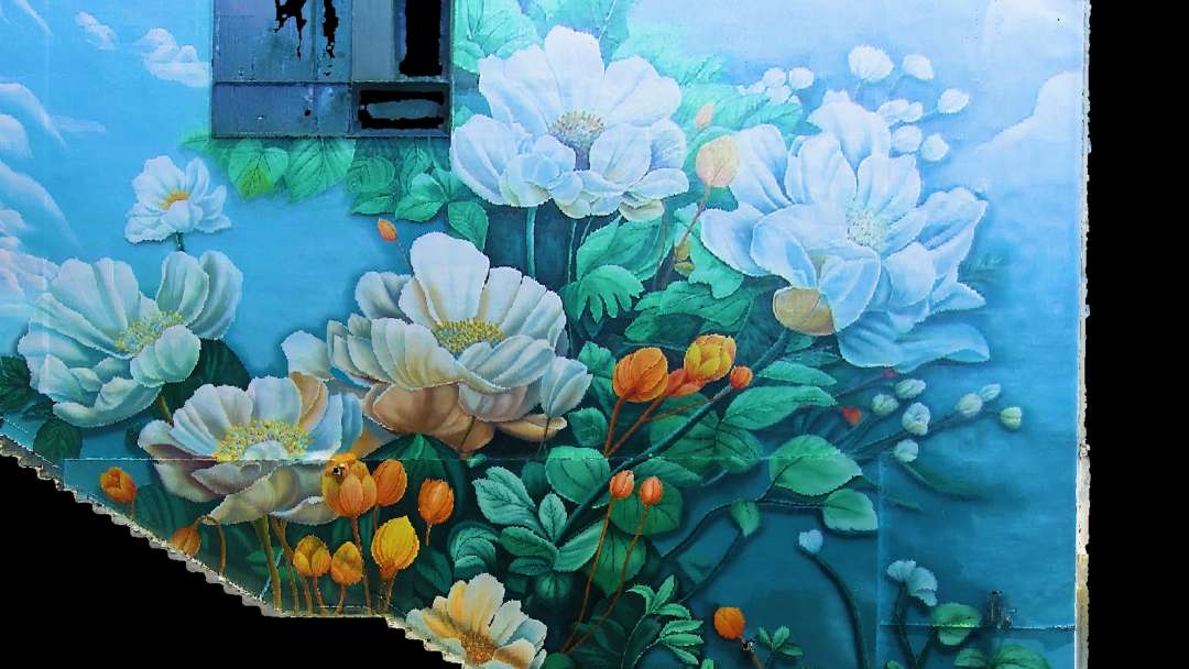 Muestra de escaneo de un panel floral con flores blancas y naranjas, que demuestra la precisión en la reproducción del color