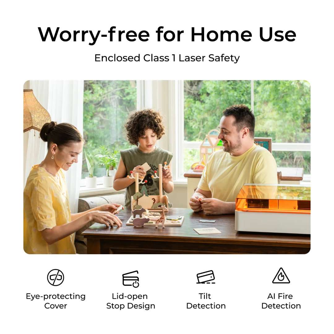 A family sitting together at a home table using xTool M1 Ultra safely — icons below illustrate four active safety features: eye-protecting cover, lid-open stop design, tilt detection, and AI fire detection