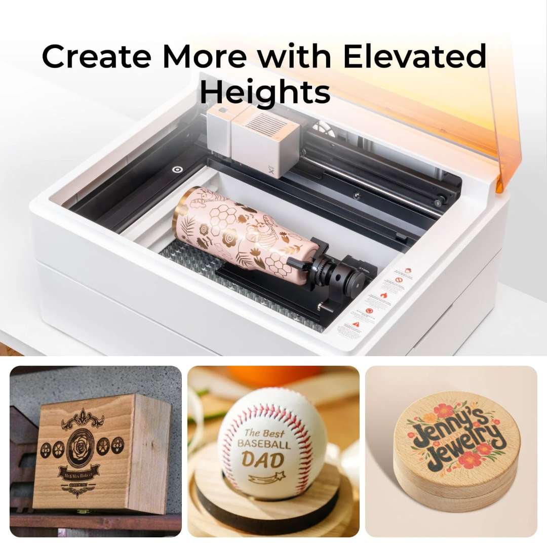 xTool M1 Ultra with open lid showing the RA2 Pro rotary attachment engraving a cylindrical tumbler with floral designs, alongside a finished engraved wooden crate, personalised baseball, and jewellery canister