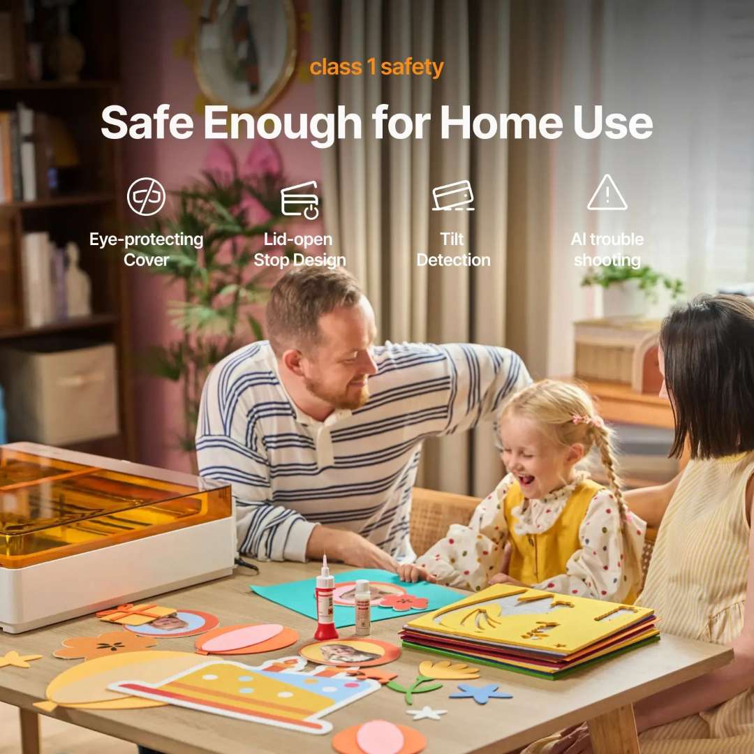 xTool M2 Class 1 laser safety for home use — family working at table near machine, icons showing eye-protecting cover, lid-open stop design, tilt detection and AI troubleshooting
